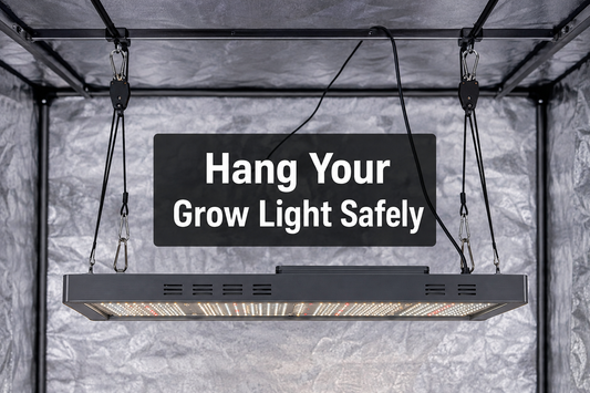 Illustrative LED fixture suspended level from rope ratchet hangers inside a tent