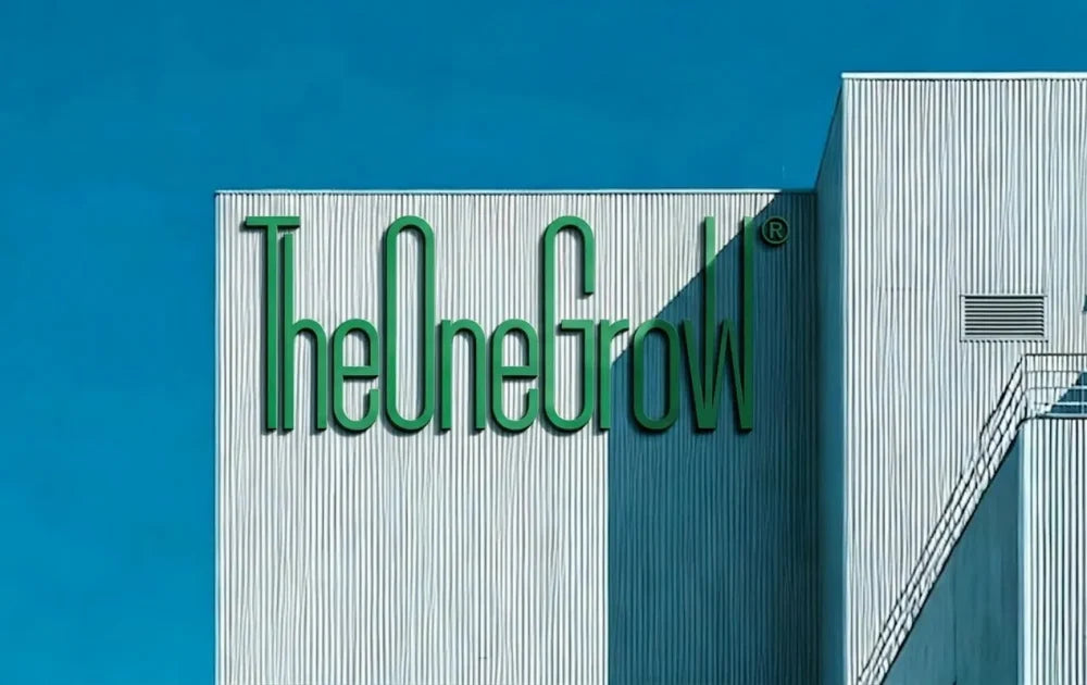 TheOneGrow brand sign on a manufacturing building