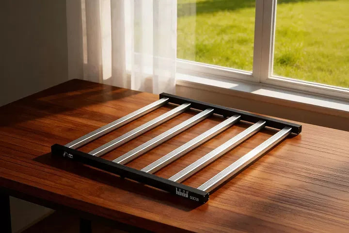 TheOneGrow OC Series multi-bar LED grow light in a bright indoor setting